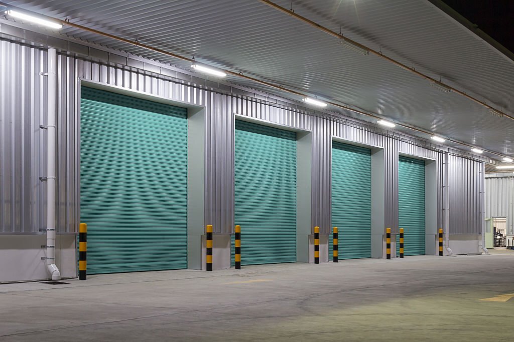 Shutter door or roller door and concrete floor outside factory building use for industrial background.